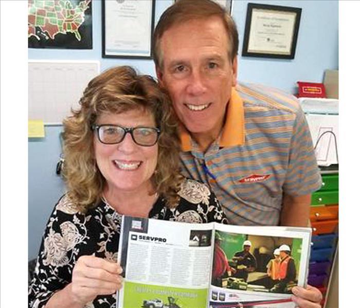 SERVPRO Gainesville/Alachua West owners Mark & Becky Raymond pose with Entrepreneur Magazine ranking SERVPRO #1